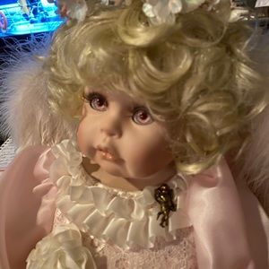 PORCELAIN DOLL WITH ANGEL WINGS